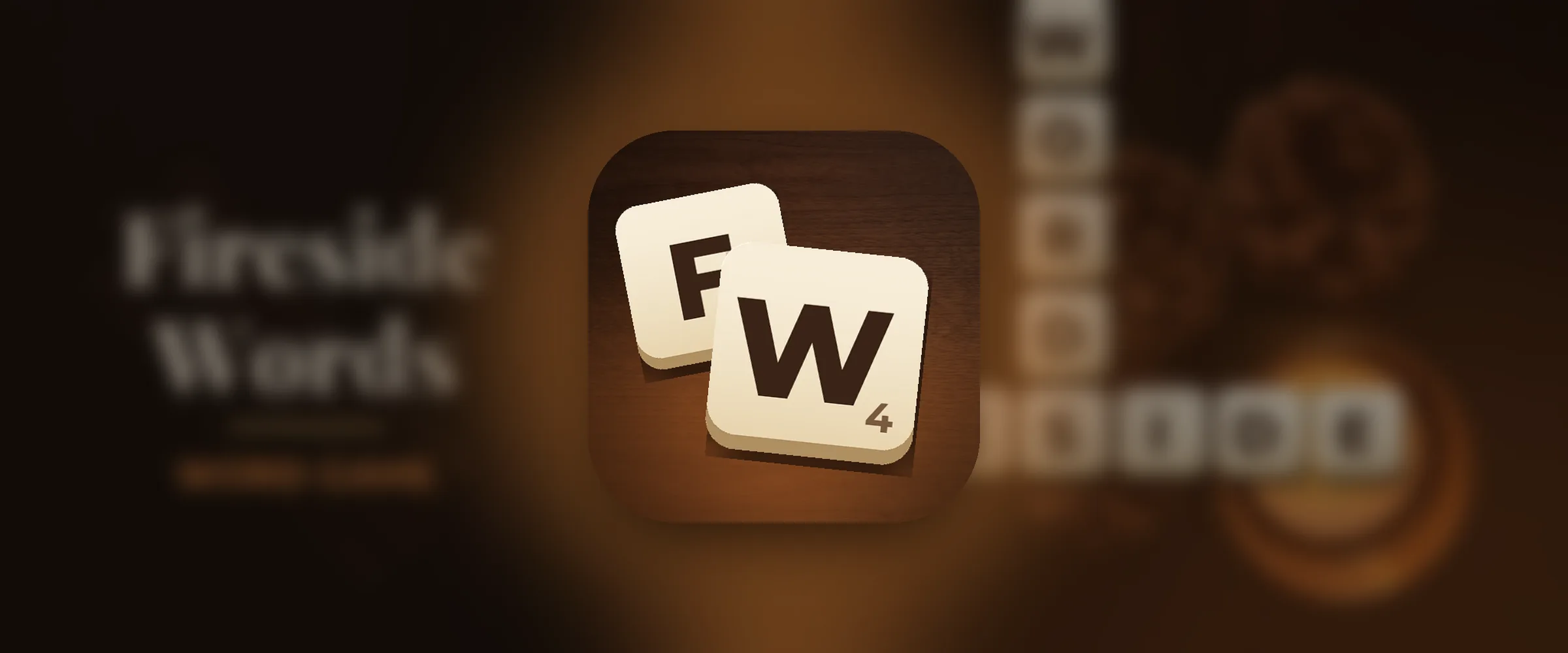 The Fireside Words icon, two ivory letter tiles F and W on dark walnut in the glow of the fire
