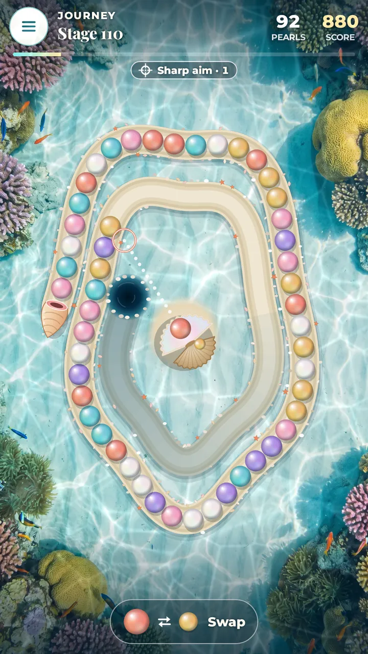 A stage in progress: a chain of pink, aqua, gold and violet pearls rolling along a winding sand path over a sunlit lagoon, the giant clam in the middle aiming with a dotted line