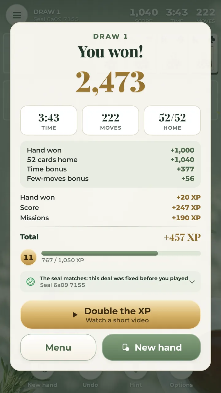 A won hand: 2,473 points with the time and few-moves bonuses, the XP earned and the seal check showing the deal was fixed before play