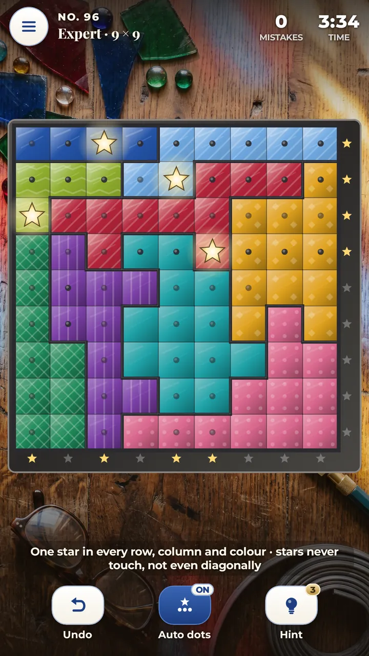 An Expert 9×9 stained glass panel in progress: coloured glass regions with lead lines, glowing gold stars, small dots marking empty squares, and star counters along the right and bottom edges