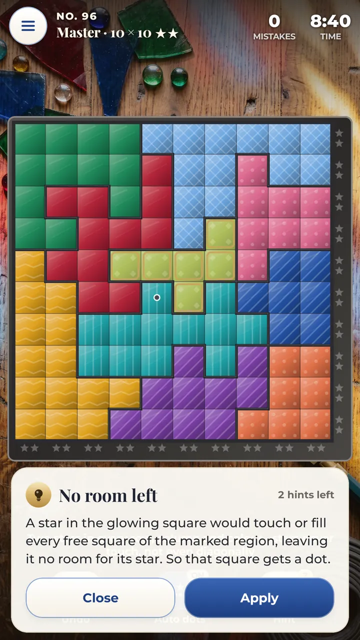 A hint on a Master 10×10 panel with two stars per region: the panel names the step, explains it in plain words and highlights the squares that matter, with an Apply button